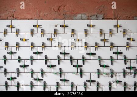 View on tile leveling system with plastic clips and wedges Stock Photo