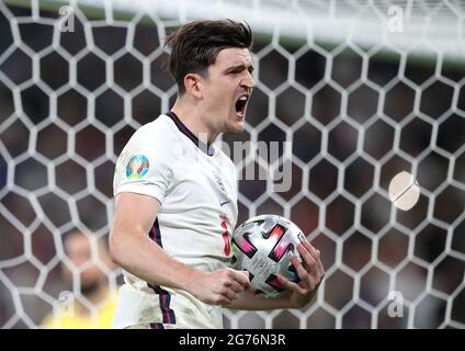 England's Harry Maguire celebrates scoring in the penalty shoot-out during the UEFA Euro 2020 Final at Wembley Stadium, London. Picture date: Sunday July 11, 2021. Stock Photo