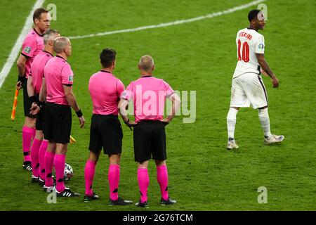 London, UK. 11th July, 2021. Football: European Championship, Italy - England, final round, final at Wembley Stadium. England's Raheem Sterling (r) walks away from referee Björn Kuipers (2nd from left) and his colleagues. Credit: Christian Charisius/dpa/Ģ����ý Live News Stock Photo