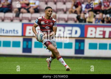 Wigan, UK. 11th July, 2021. Umyla Hanley (30) of Wigan Warriors with the ball in Wigan, United Kingdom on 7/11/2021. (Photo by Simon Whitehead/News Images/Sipa USA) Credit: Sipa USA/Alamy Live News Stock Photo