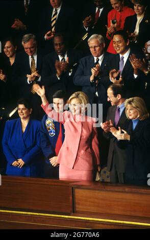 Washington, DC, USA. 27th January 1998. U.S. First Lady Hillary Rodham Clinton waves from the gallery shortly before the start of the annual State of the Union address to Congress on Capitol Hill January 27, 1998 in Washington, D.C. NASA Shuttle Commander Colonel Robert Cabana, left, Director of the National Institutes for Health Dr. Harold Varmus, center, and Tipper Gore, wife of Vice President Al Gore, right, look on. Stock Photo