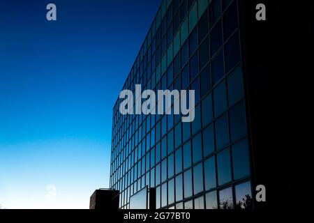 High rise building against the vignette clear blue sky Stock Photo