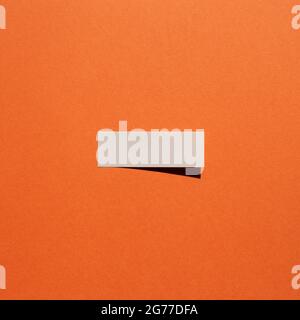 Blue sticky note paper on red background. copy space Stock Photo