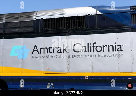 Amtrak California a service of the California Department of Transportation sign on diesel passenger locomotive. - San Jose, California, USA - 2021 Stock Photo