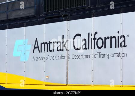 Amtrak California a service of the California Department of Transportation sign on diesel passenger locomotive. - San Jose, California, USA - 2021 Stock Photo