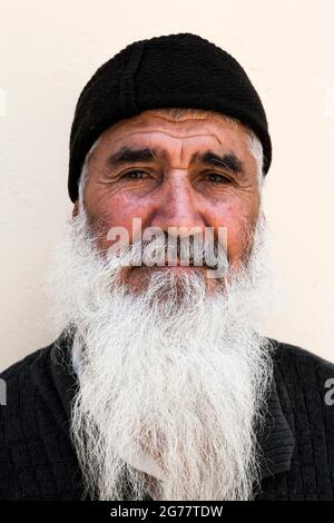 Man with long white beard, at backyard of Tehran bazaar, historical trading center, Tehran, Iran, Persia, Western Asia, Asia Stock Photo