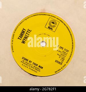 Stand by your man by Tammy Wynette, a stock photo of the 7' single vinyl 45 rpm record in cover Stock Photo