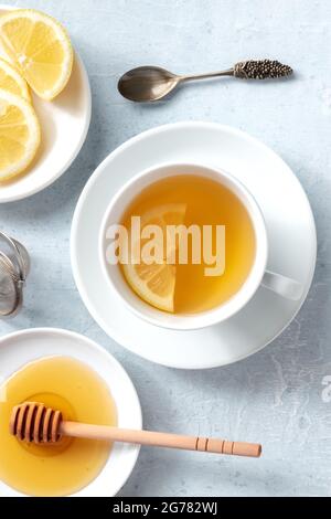A cup of lemon tea with honey, shot from the top. Healthy organic citrus detox beverage Stock Photo