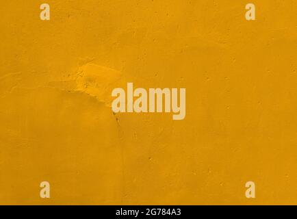 Wall textured rusty painting gold yellow background of cement or stone. Stock Photo