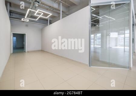 Modern white empty room interior with columns and panoramic windows.  room for office or store Stock Photo