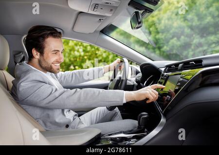 Touch screen control in modern comfortable car, people and technology Stock Photo
