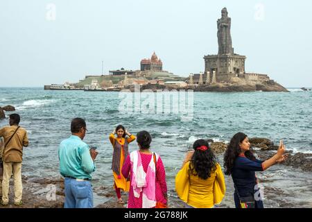 Hindu worshippers doing selfies at Vivekananda Rock Memorial & Thiruvalluvar Statue, Kanyakumari, Tamil Nadu, India Stock Photo