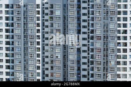 front of high rise building with many apartment house facade in straight view, development real estate at Ho Chi Minh city to make multifamily house Stock Photo