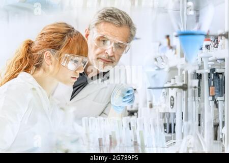 Health care researchers working in scientific laboratory. Stock Photo