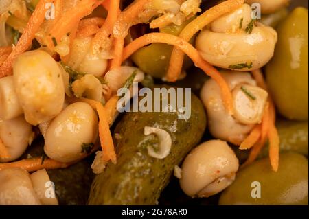 Pickled mushrooms and pickled cucumbers. Close-up Selective focus Stock Photo