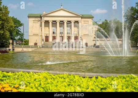 The front of the Grand Theater in Poznan. The pond and fountain of the Mickiewicza park can be seen in the foreground. Stock Photo