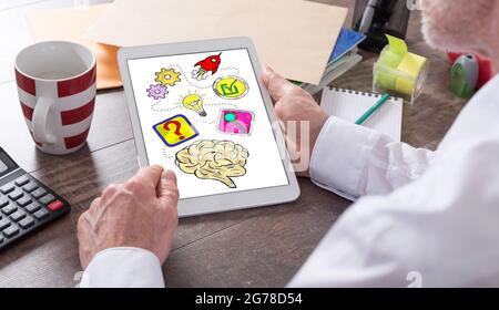Problem solving concept shown on a tablet held by a man Stock Photo