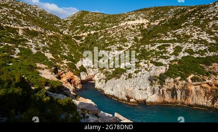 Ionian Islands, Zakynthos, west coast, Adriatic Sea, view of the deeply indented bay towards the hill in the east, blue water, overgrown hill rises at the end of the bay, blue sky with a single white cloud Stock Photo