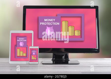 Money protection concept shown on different information technology devices Stock Photo