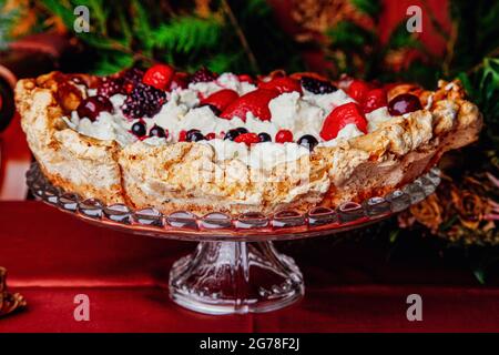 Pavlova, dessert, meringue, mascarpone, strawberries, forest fruits Stock Photo
