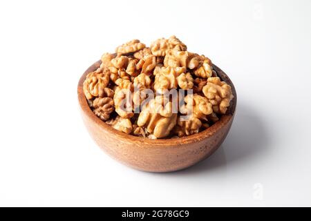 Walnuts in a bowl on a white background Stock Photo