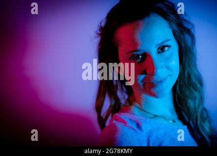 Young woman in her mid-20s - RGB colored portait shot Stock Photo