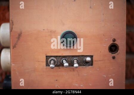Old electricity switches. Amplifier control. Power buttons. Stock Photo