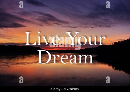 Live your dream inspirational trendy inscription on beautiful sunset panorama background. Greeting card with calligraphy. Stock Photo
