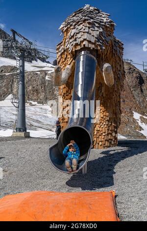 Europe, Austria, Tyrol, Stubai Alps, mammoth slide at the mountain station of the 3S-Bahn Eisgrat mountain station on the Stubai Glacier Stock Photo