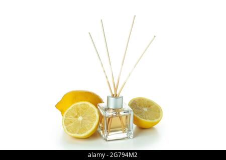 Diffuser bottle with sticks and lemons isolated on white background Stock Photo