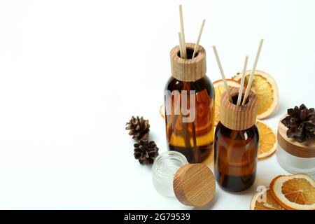 Diffusers, lemons and cones on white background Stock Photo