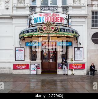 The Criterion Theatre, London. The entrance to a West End Theatre in Piccadilly Circus with the play 'A Comedy About A Bank Robbery' in production. Stock Photo