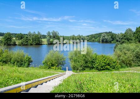 Germany, Baden-Wuerttemberg, Welzheim-Aichstrut, Aichstrut flood retention basin, Aichstruter reservoir, bathing area with sunbathing area. Excursion destination, local recreation area in the Welzheimer Forest in the Swabian-Franconian Forest Nature Park. Stock Photo