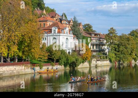 Germany, Baden-Wuerttemberg, Tübingen, on a beautiful autumn day in October, many people enjoy themselves on a boat trip with the punt on the Neckar. On the left bank the University of Church Music of the Evangelical Church in Württemberg. Stock Photo