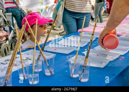 children's holiday in the park,child waiting to receive brushes and paints for painting;Sofia,Bulgaria. Stock Photo
