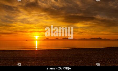 dramatic sunrise on Playa de Muro Stock Photo
