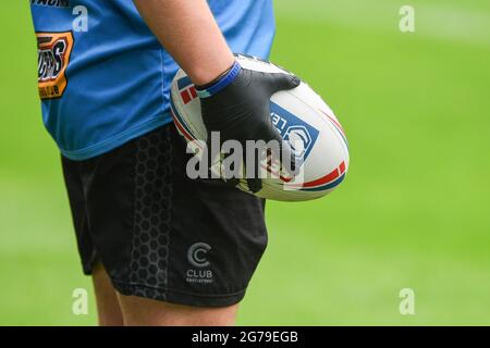 Castleford, England - 11 July 2021 - Castleford Tigers staff member wears latex gloves, to prevent contact with ball due to Covid 19 restriction, during the Rugby League Betfred Super League Castleford Tigers vs Salford Red Devils at The Mend-A-Hose Stadium, Castleford, UK  Dean Williams/Alamy Live Stock Photo