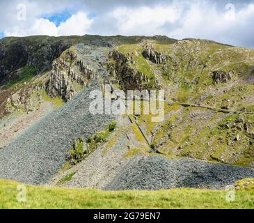 Abandoned slate mine workings ad disused tramways at the head of Honister Pass in the English Lake District Cumbria UK Stock Photo
