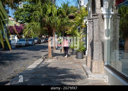 Famous Stone Street (Rua das Pedras) in Buzios, Brazil is full of shops and restaurants and is a popular tourist spot at night. Stock Photo