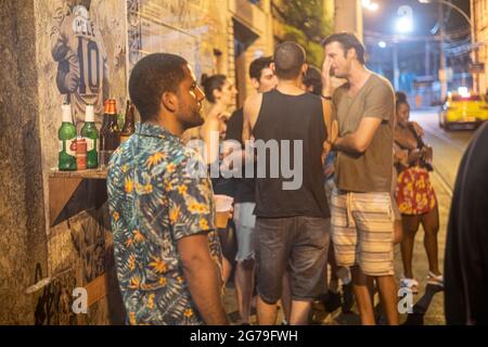 Authentic Party with the locals in the Streets and bars of Santa Teresa, Rio de Janeiro, Brazil at a warm summernight. Shot with Leica M10 Stock Photo