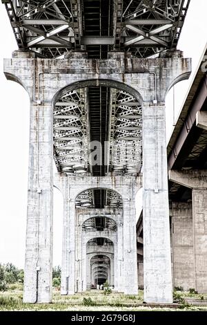 Concrete pillars under highway bridge. Burlington Bay James N. Allan Skyway. Burlington Ontario Canada Stock Photo