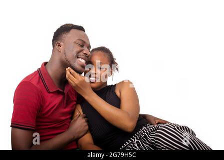 Close Up portrait of a couple having a romantic moment.new couple in love lying on his girlfriend looking at each other and kissing together. Stock Photo
