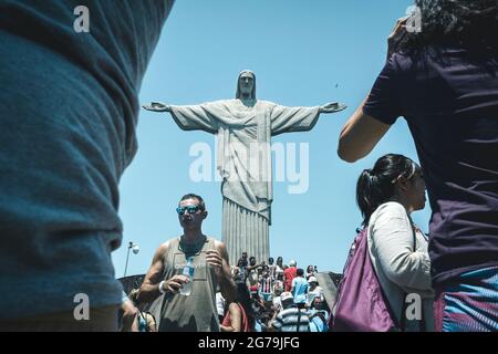 Lots of Tourists at the Christ the Redeemer (Cristo Redentor) statue atop the Corcovado Mountain in Rio de Janeiro, Brazil. Stock Photo