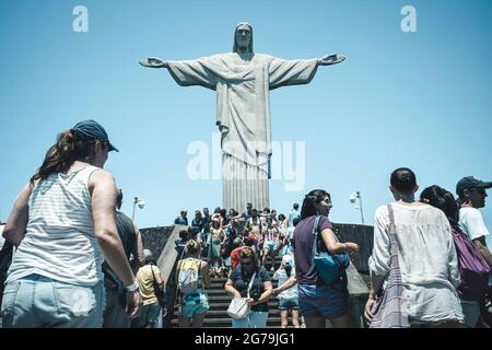 Lots of Tourists at the Christ the Redeemer (Cristo Redentor) statue atop the Corcovado Mountain in Rio de Janeiro, Brazil. Stock Photo