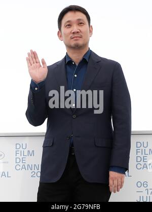 Cannes. 12th July, 2021. Director Ruysuke Hamaguchi poses during the photocall for the film 'Drive My Car' at the 74th annual Cannes Film Festival, in Cannes, France, July 12, 2021. Credit: Xinhua/Alamy Live News Stock Photo