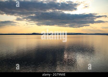 Beautiful sunrise over the ocean with sunlight shining between the clouds, Sognefjord, the country’s longest and deepest, Close to Bergen, Norway. Stock Photo