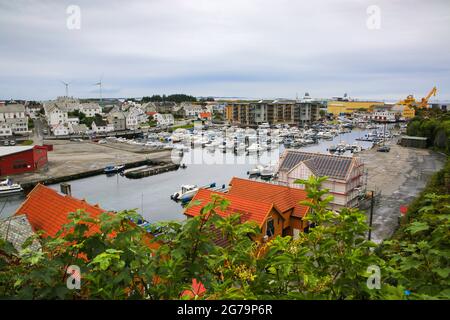 Smedasundet area and river in the center of the town. Surrounded by traditional buildings and boats in the water, Haugesund, Norway. Stock Photo