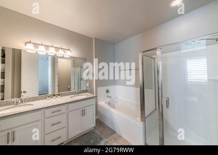 Large master bathroom with ambient lights and separated toilet Stock Photo