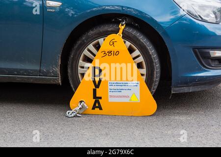 DVLA Wheel Clamp on an Untaxed Vehicle, UK Stock Photo