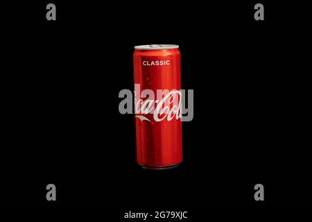 KALININGRAD, RUSSIA - MARCH 13, 2021 - Coca Cola can, black background. Classic coke jar, carbonated soft drink. Manufactured by The Coca-Cola Company Stock Photo